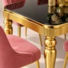 Close up of black marble dining table top and gold fluted detailing