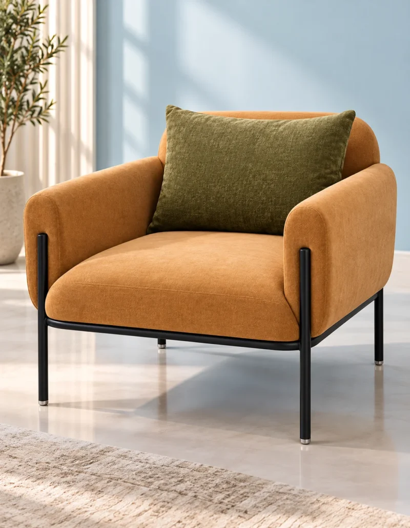 Luxury caramel upholstered lounge chair with olive-green back cushion and black stainless steel frame against a pale blue wall.
