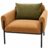 Velora Luxe caramel fabric accent chair with rounded padded arms, olive-green cushion and black stainless steel legs on white background.