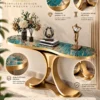 Virella Luxe teal marble console table with gold stainless steel dual-wing pedestal and premium material feature callouts.