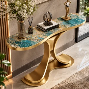 Elevated angled view of teal blue marble console table with gold veining, rounded ends and sculptural stainless steel pedestal.