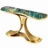 Virella Luxe teal blue marble console table with gold stainless steel dual-wing pedestal and elongated rounded top on white background.