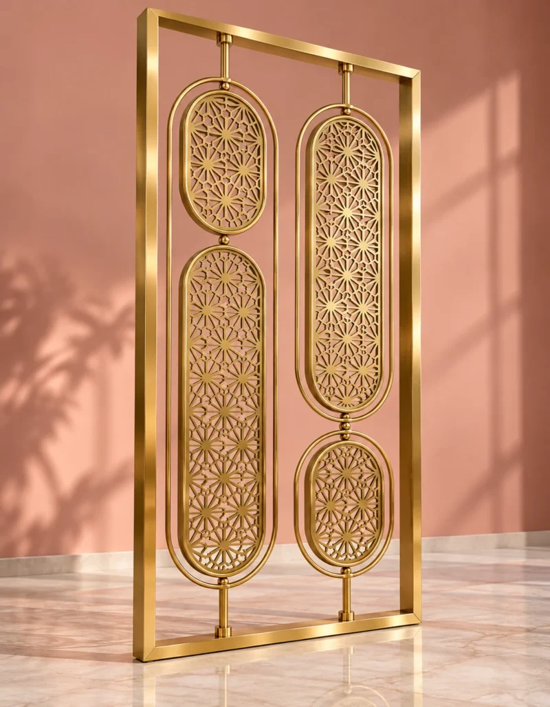 Angled view of gold stainless steel room divider with floral oval lattice panels