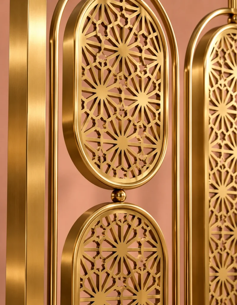 Close-up of intricate floral starburst lattice on gold stainless steel partition