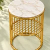 Zenvora Luxe gold lattice marble side table with round white top and cylindrical steel base on light green background