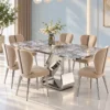Modern six seater marble dining table with polished silver sculptural base and cream fabric dining chairs