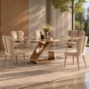 Six seater designer marble dining table with rose gold sculptural base and beige upholstered dining chairs