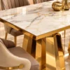 Close up of marble dining table top and gold stainless steel base