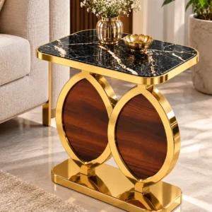 Luxury black marble side table with gold-finish dual oval frame and walnut-look panels positioned beside a beige sofa.