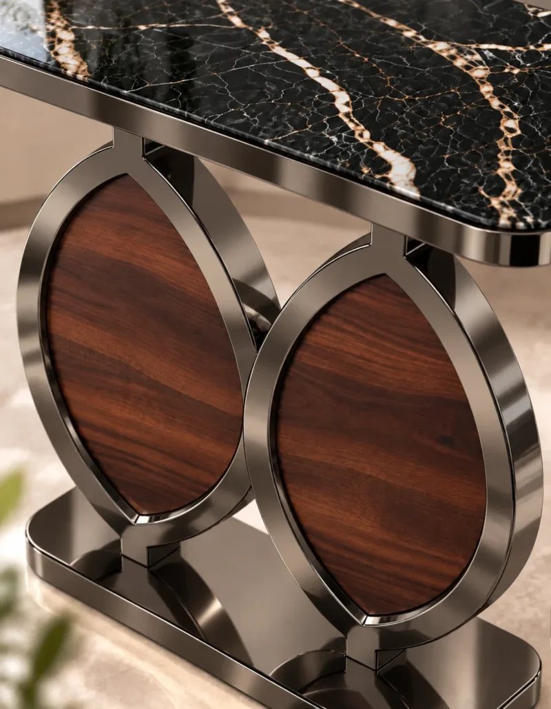 Close-up of black marble side table showing champagne graphite veining, polished metal frame and walnut-look oval support panels.